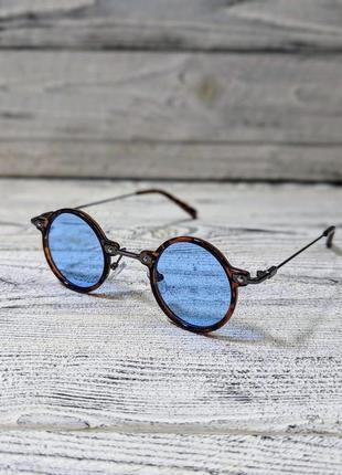 Солнцезащитные очки унисекс, круглые, голубые в леопардовой пластиковой  оправе ( без бренда )1 фото