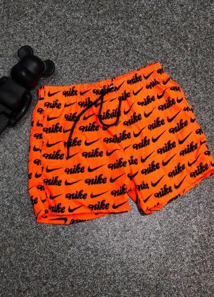 Крутые оранжевые мужские шорты с надписями3 фото