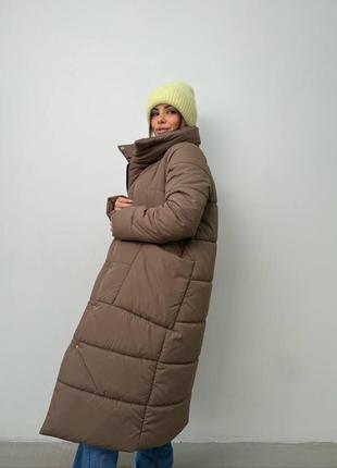 Теплая длинная дутая стеганая зимняя куртка на экопух, объемная куртка на зиму с глубокими карманами на кнопках7 фото