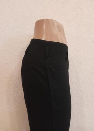 Черные женские брюки из искусственной костюмной ткани4 фото