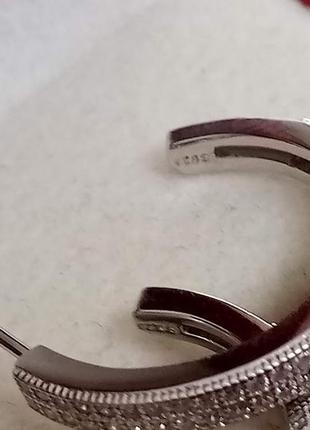 Серебряные серьги полукольца с фианитами микропаве6 фото