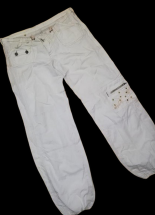 Белые брюки бойфренды с заклепками1 фото