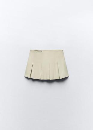 Мини юбка из экокожи с бантовыми складками5 фото