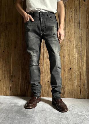 Серые джинсы diesel tepphar distressed slim-carrot1 фото