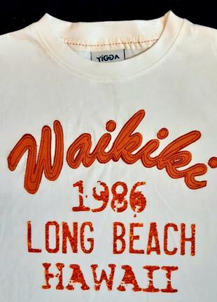 Біла з теракотовим футболка waikiki бренду тополина "yigga" німеччина на 9-10 років