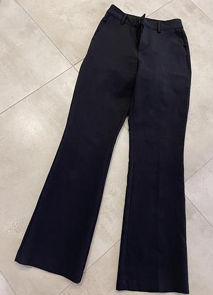 Штани класичні знизу розширені