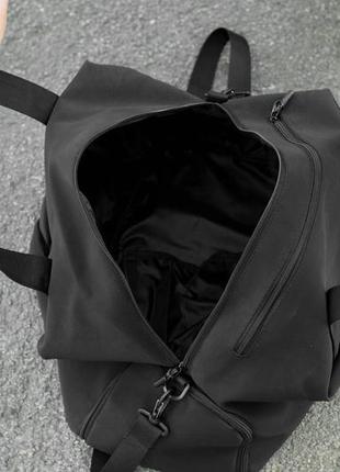 Жіноча дорожня спортивна сумка з відділення під взуття vast  на 34 літрів чорна з матеріалу soft shell10 фото