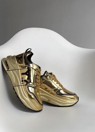Кросівки золоті