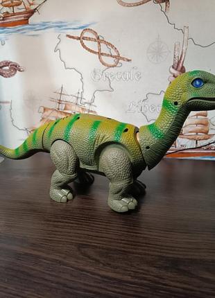 Игрушка динозавр ходит, звуковые и световые эффекты 666-3a, животные динозавр1 фото