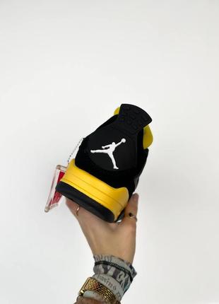 Кроссовки air jordan 4 thunder 2023 черные с желтым жемчужные / мужские2 фото