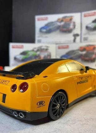 Дрифт машинка на радиоуправлении nissan gt-r r35 оранжевый. машинка на пульте радиоуправления для дрифта3 фото