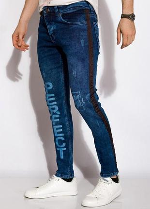 Новые неординарные мужские синие джинсы с потертостями принтом и лампасами2 фото