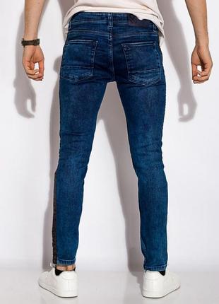 Новые неординарные мужские синие джинсы с потертостями принтом и лампасами3 фото