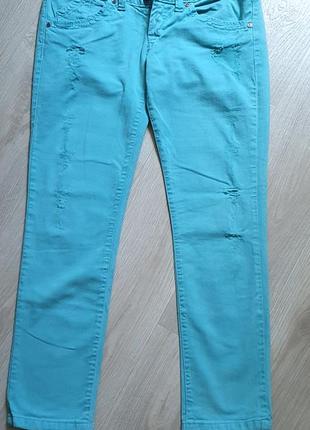 Шикарні бірюзові джинси з потертостями3 фото