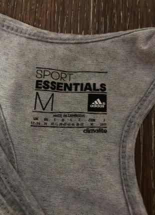 Жіноча спортивна майка adidas essentials linear tank top8 фото