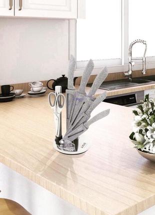 Набір кухонних ножів 7 предметів на крутній підставці a-plus kf09969 фото