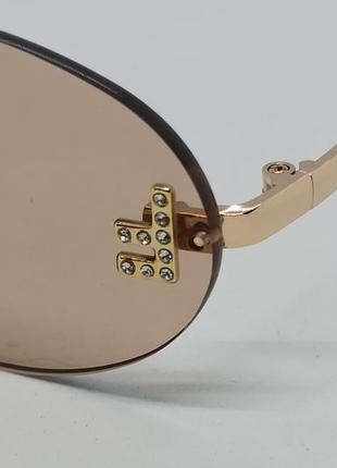 Окуляри в стилі fendi Teen жіночі сонцезахисні овальні бежеві безоправні з золотим логотипом3 фото