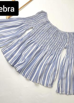 Блуза жіноча блакитного кольору у смужку вільного крою від бренду zebra xs