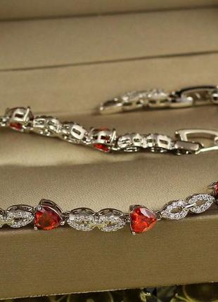 Браслет xuping jewelry свято з червоним камінням 19 см 5 мм сріблястий1 фото