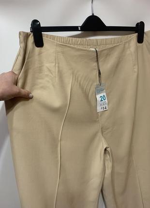 Бежевые брюки с широкими штанинами2 фото
