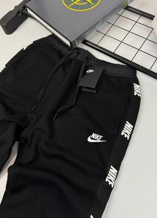 Штани nike на лампасах1 фото