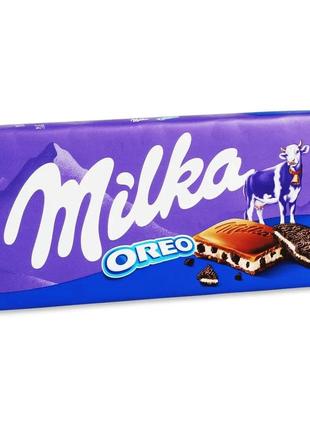 Шоколад milka молочний з молочною начинкою зі смаком ванілі та шматочками печива oreo 100 г