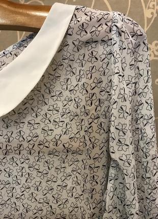 Очень красивая и стильная брендовая блузка в бантиках.4 фото