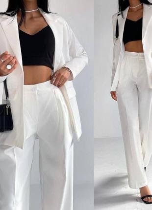 Костюм женский однонтонный классический оверсайз пиджак на пуговице брюки свободного кроя на высокой посадке с карманами качественный базовый белый1 фото