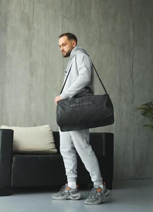 Дорожня спортивна сумка високої якості у брендовому стилі10 фото