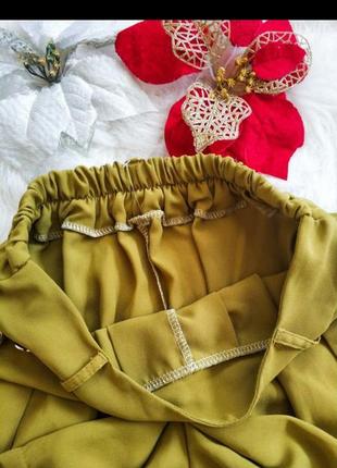 Трендові шорти-юбка модного гірчичного кольору з кишенями.4 фото