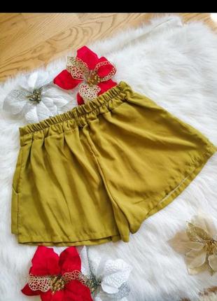 Трендові шорти-юбка модного гірчичного кольору з кишенями.5 фото