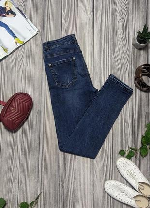 Плотные темно-синие джинсы с потериостями2 фото
