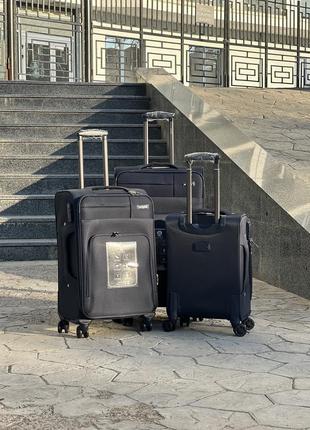 Качественный чемодан из плотной ткани фирмы nuri,надежные колеса,расширение,чемодан,кодовый замок, большой,средний,маленький, дорожная сумка3 фото