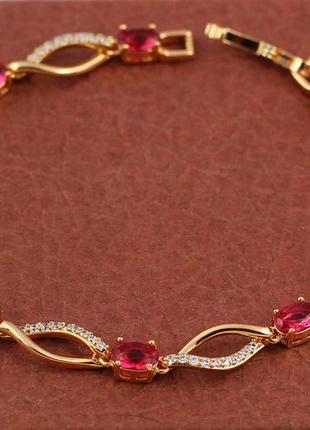 Браслет xuping jewelry коса с дорожкой из белых фианитов и с красными камнями 19 см 6 мм золотистый1 фото