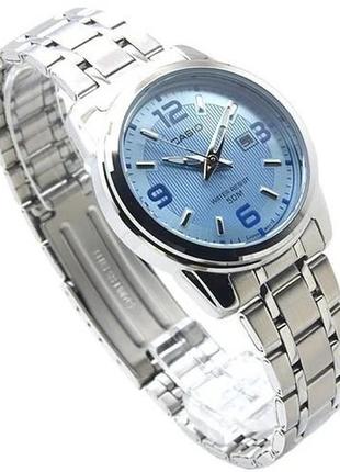 Женские часы casio lady classic ltp-1314d-2avdf, голубые с серебрянным браслетом