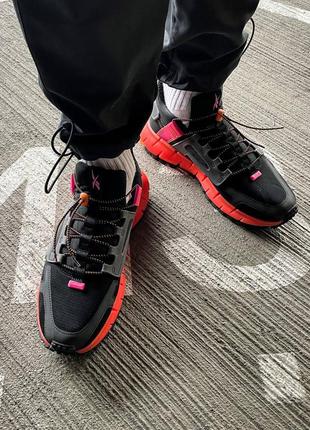 Кросівки жіночі / чоловічі чорні / оранжеві reebok zig kinetica edge 'black high vis orange'