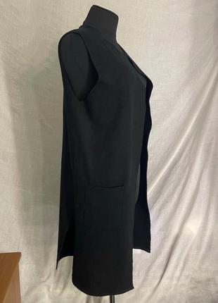 Трикотажный черный кардиган без рукавов с карманами удлиненный оstin3 фото