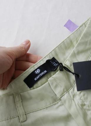 Актуальні мерехтливі широкі брюки атласні у фісташковому відтінку4 фото