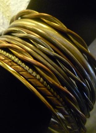 Винтаж браслеты комплект тонкие серебристые, золотистые, бронзового кольца1 фото