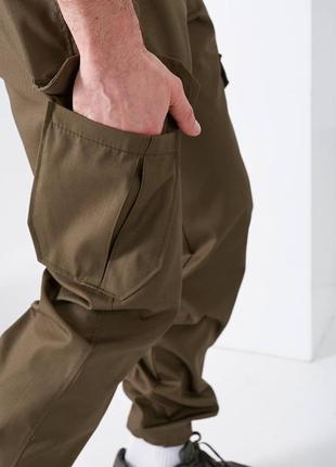 Чоловічі тактичні штани накладні кишені з клапаном понизу фіксатор2 фото