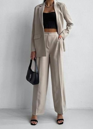 Очень стильный женский классический брючный костюм с брюками палаццо и пиджаком2 фото