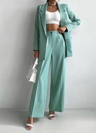 Очень стильный женский классический брючный костюм с брюками палаццо и пиджаком3 фото