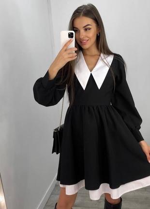 Женское черное эффектное и нарядное платье мини с акцентом2 фото