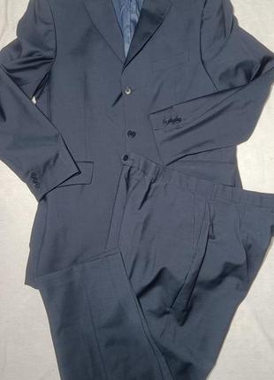 Костюм складається з піджака та брюк. чоловічий темно-синій костюм2 фото