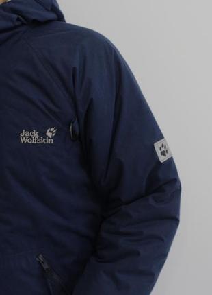 Теплящая зимняя куртка jack wolfskin синего цвета2 фото