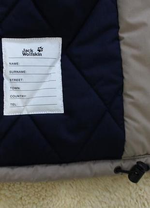 Теплящая зимняя куртка jack wolfskin синего цвета7 фото