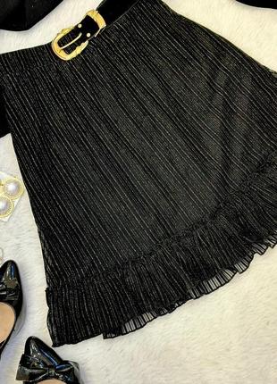Черная юбка мини с воланом блестящая2 фото