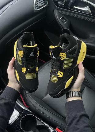 Кроссовки jordan 4 thunderм черные с желтым женские1 фото