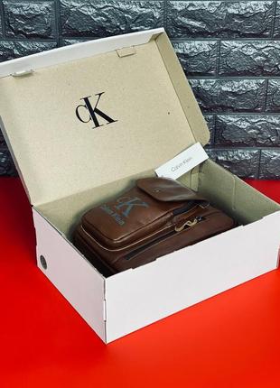 Мужская стильная кожаная сумка барсетка через плечо calvin klein коричневая сумка келвин кляйн8 фото