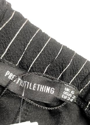 Женские брюки леггинсы черного цвета с высокой посадкой в полоску от бренда pretty little thing xs5 фото